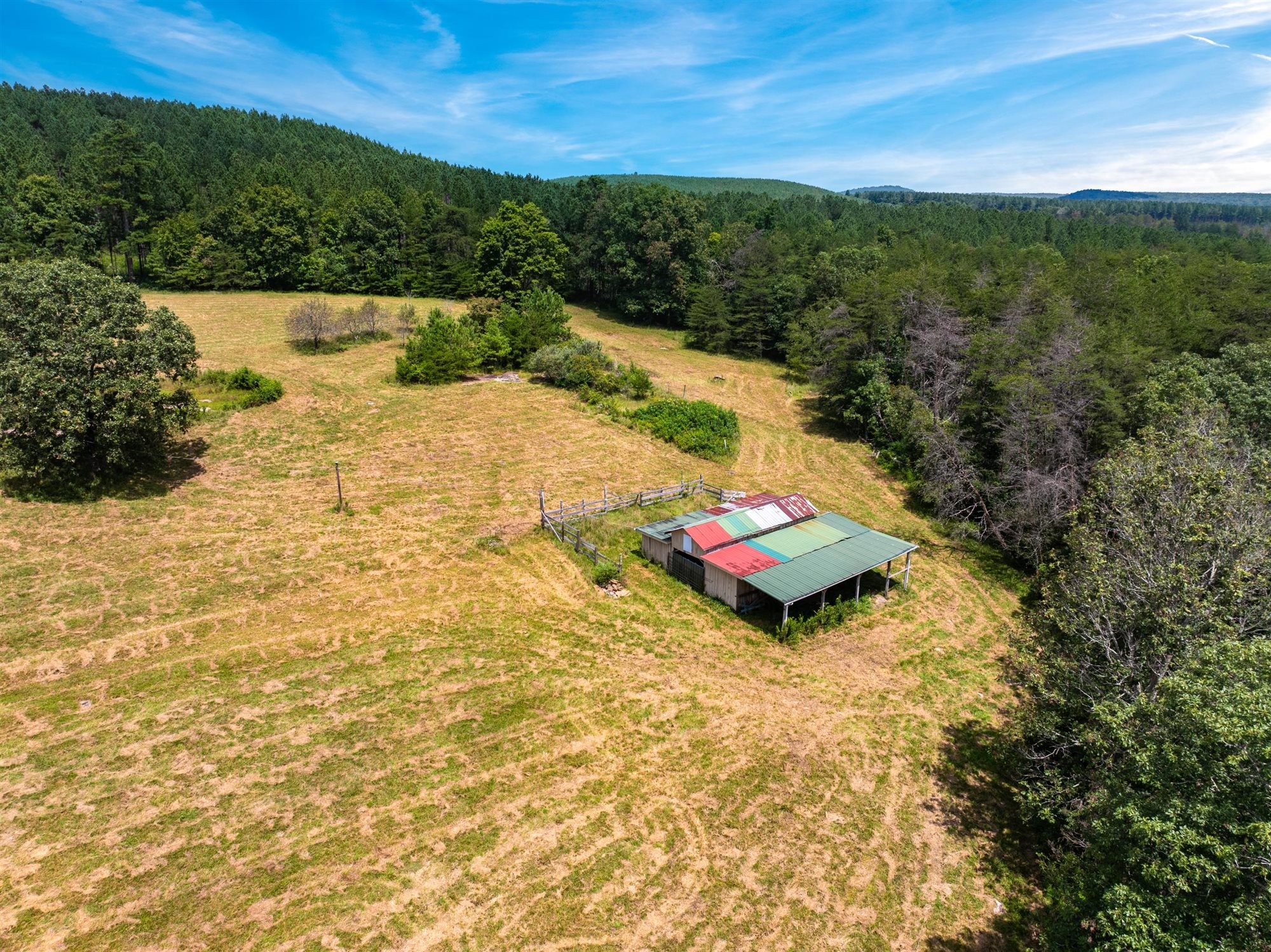 290 Lawson Town Road Crossville, TN 38572 - Photo 33 of 38 a wooden bench sitting in the middle of a field