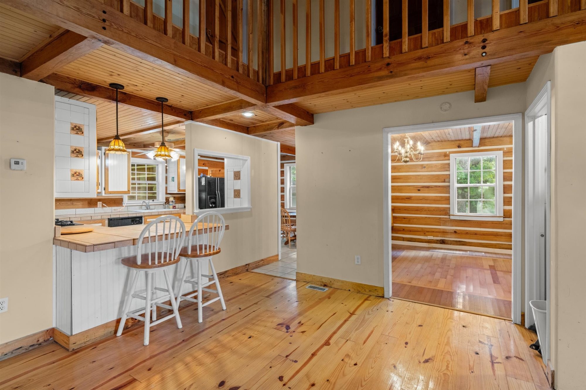 290 Lawson Town Road Crossville, TN 38572 - Photo 10 of 38 a view of a kitchen with wooden floor and chairs
