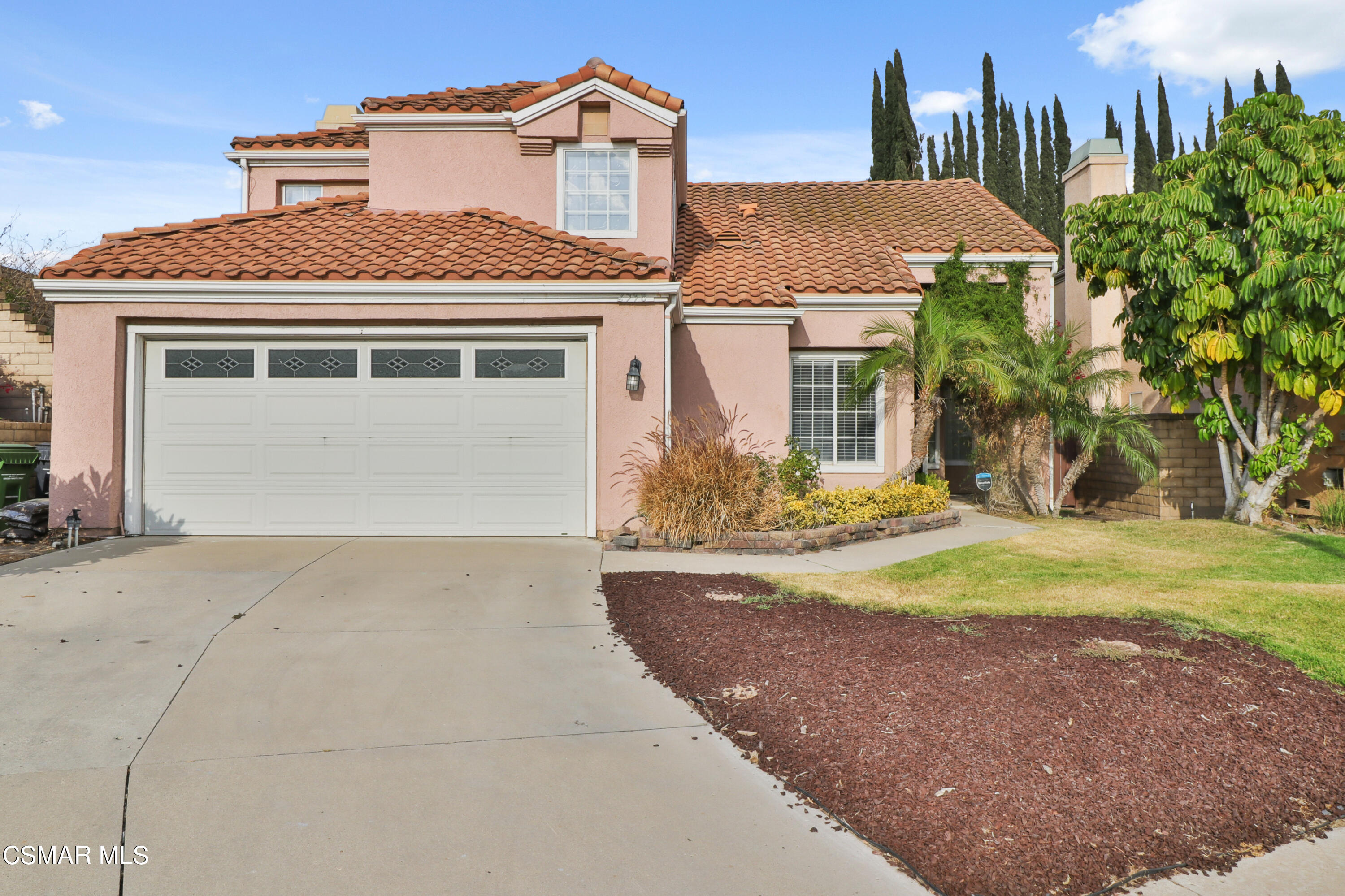 2598 Winthrop Court Simi Valley, CA 93065 - Photo 1 of 33 a front view of a house with a yard and garage
