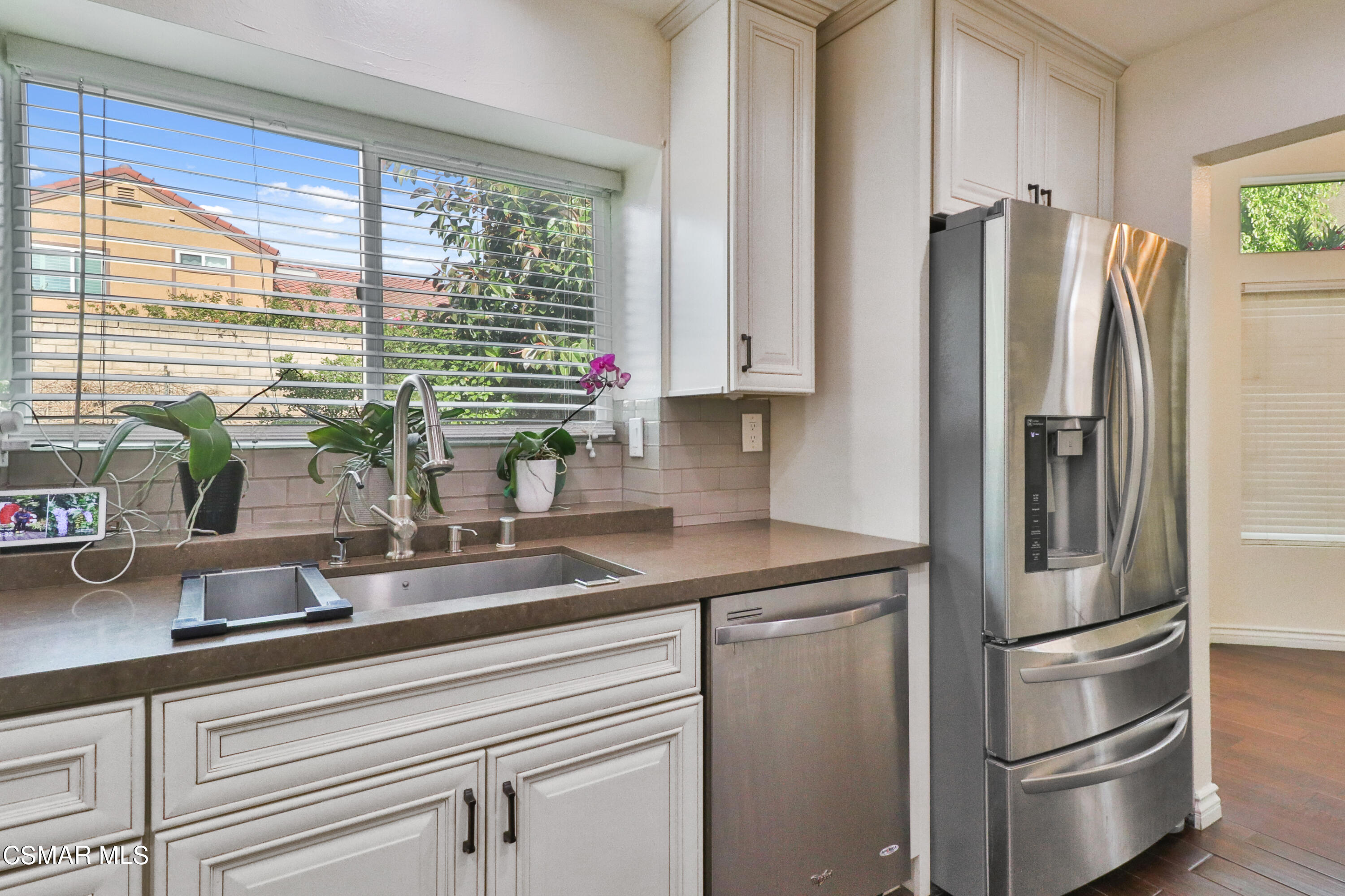 2598 Winthrop Court Simi Valley, CA 93065 - Photo 13 of 33 a kitchen with appliances a sink and cabinets