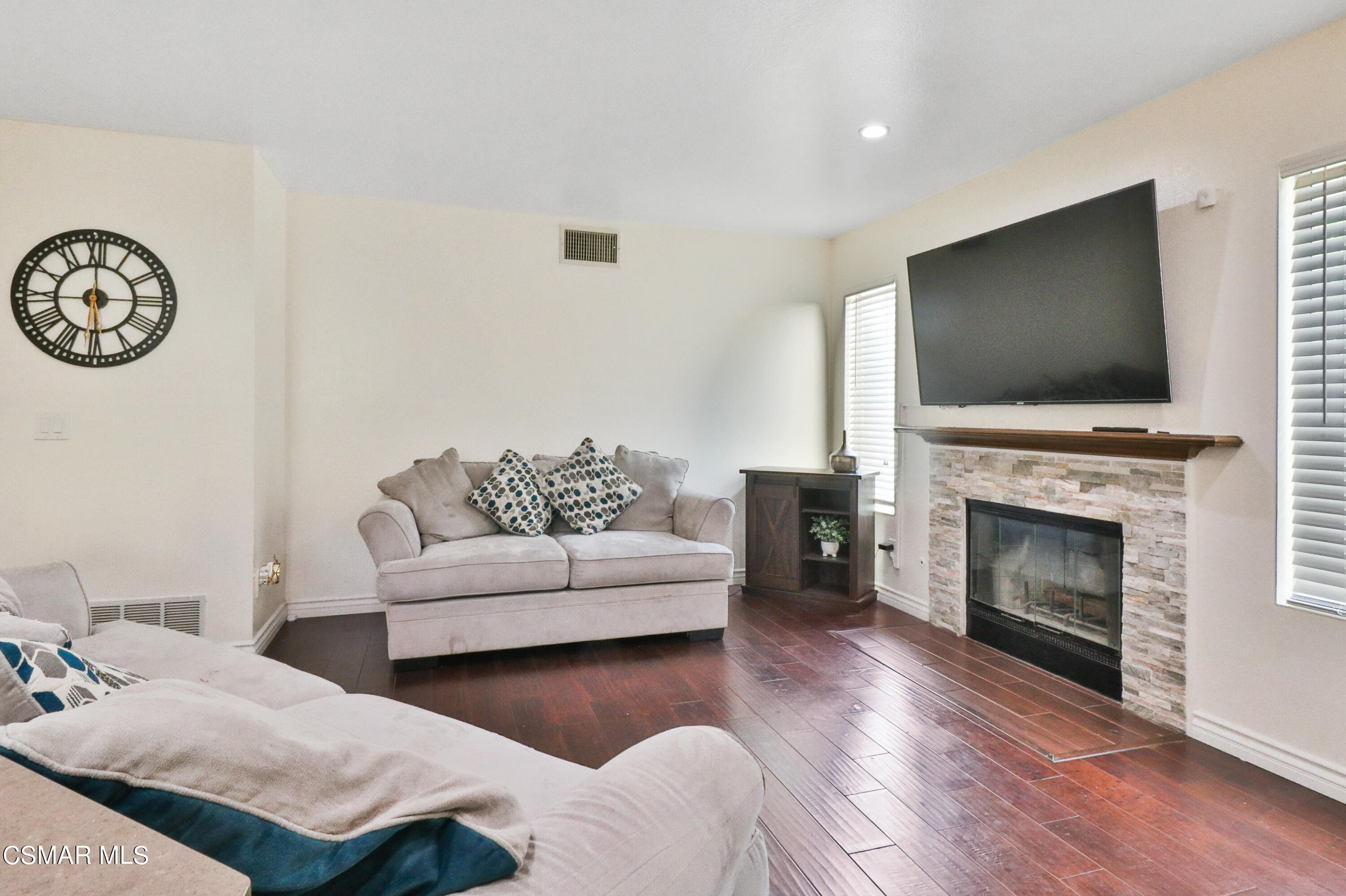 2598 Winthrop Court Simi Valley, CA 93065 - Photo 17 of 33 a living room with furniture a flat screen tv and a fireplace