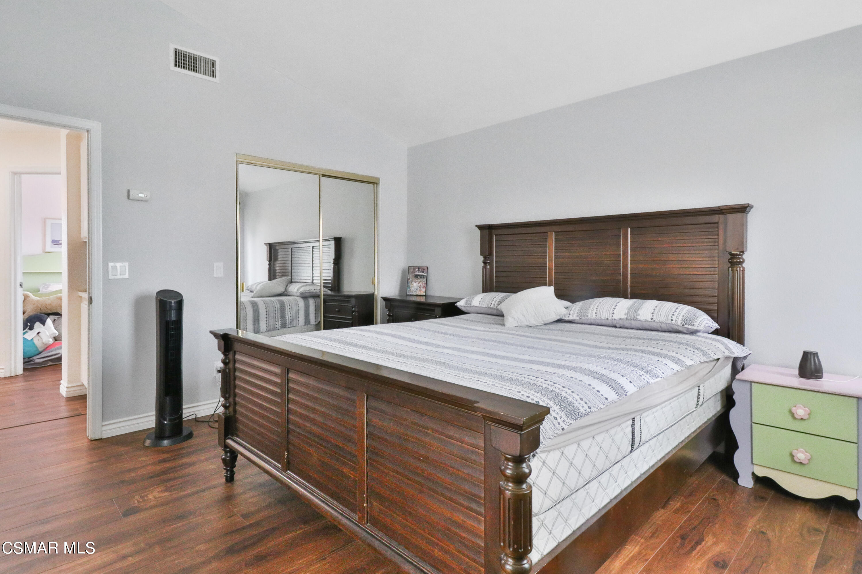 2598 Winthrop Court Simi Valley, CA 93065 - Photo 22 of 33 a bedroom with a bed and wooden floor