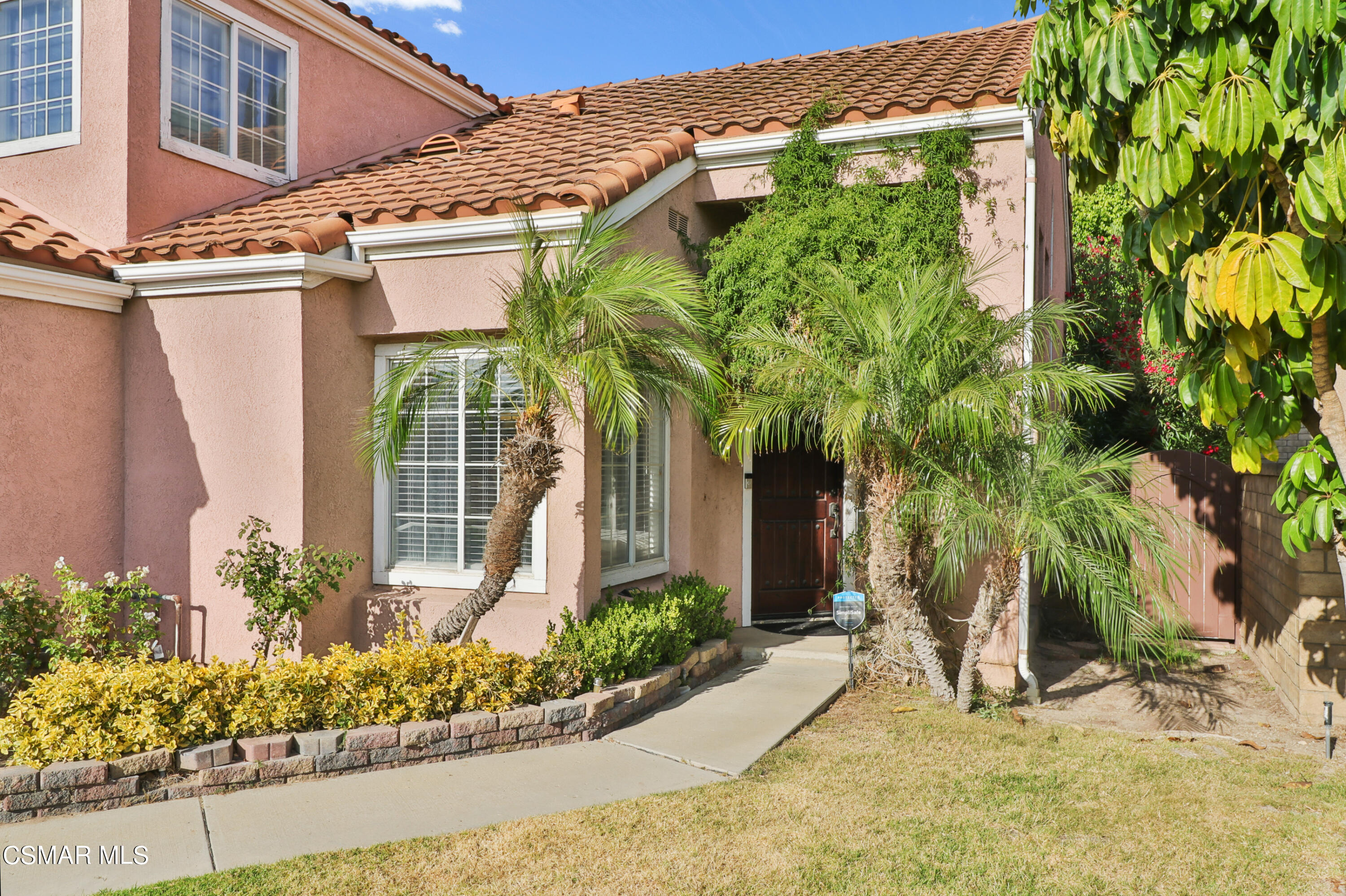 2598 Winthrop Court Simi Valley, CA 93065 - Photo 3 of 33 a view of a house with potted plants and a large tree
