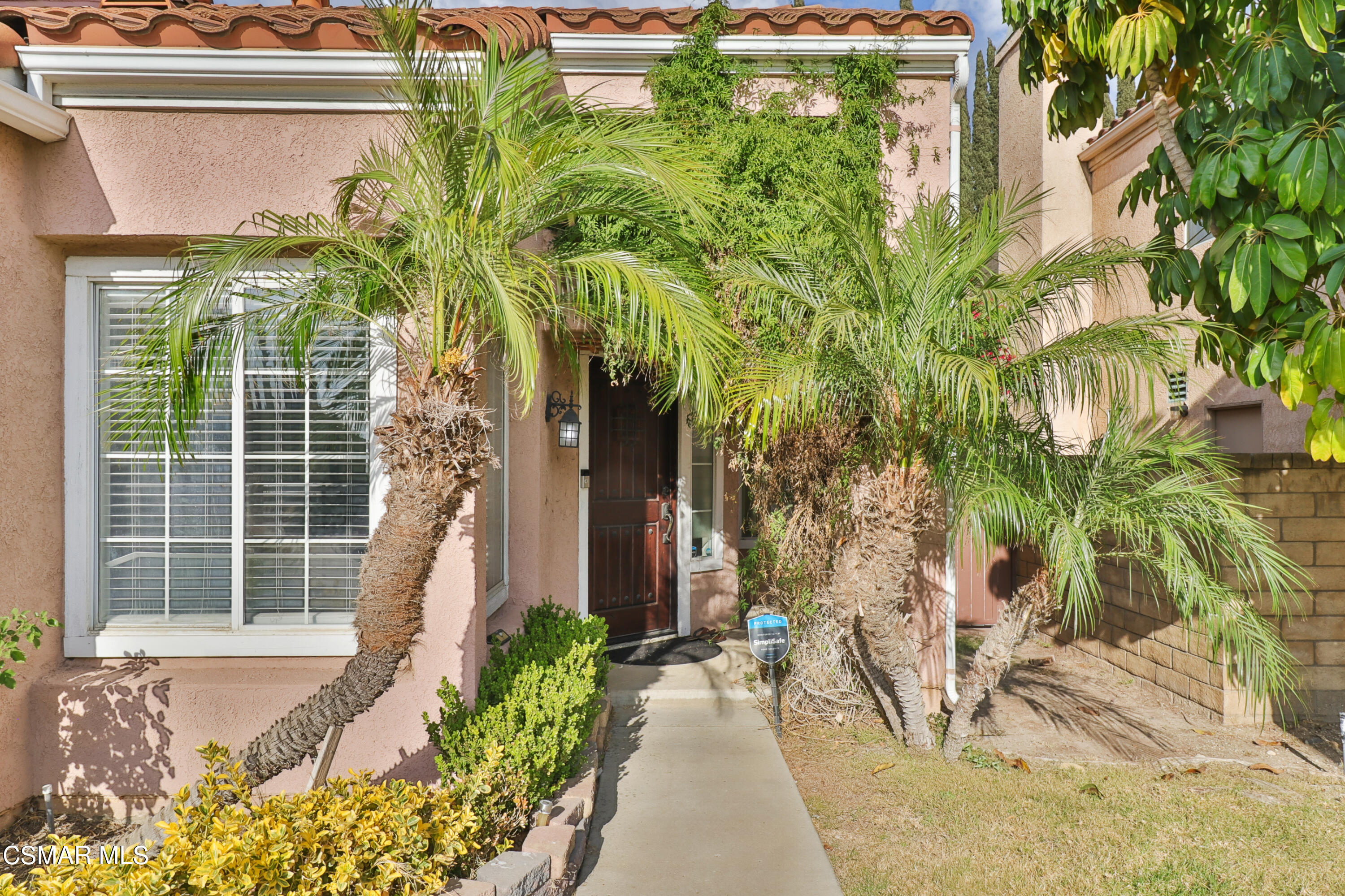 2598 Winthrop Court Simi Valley, CA 93065 - Photo 4 of 33 a front view of a house with a yard