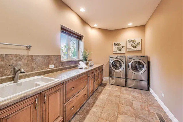 a bathroom with a granite countertop toilet sink and mirror