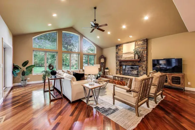 a living room with fireplace furniture and a flat screen tv