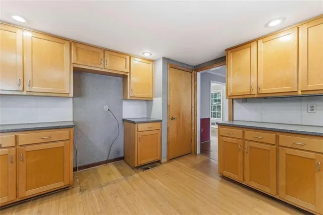 a kitchen with a sink and cabinets