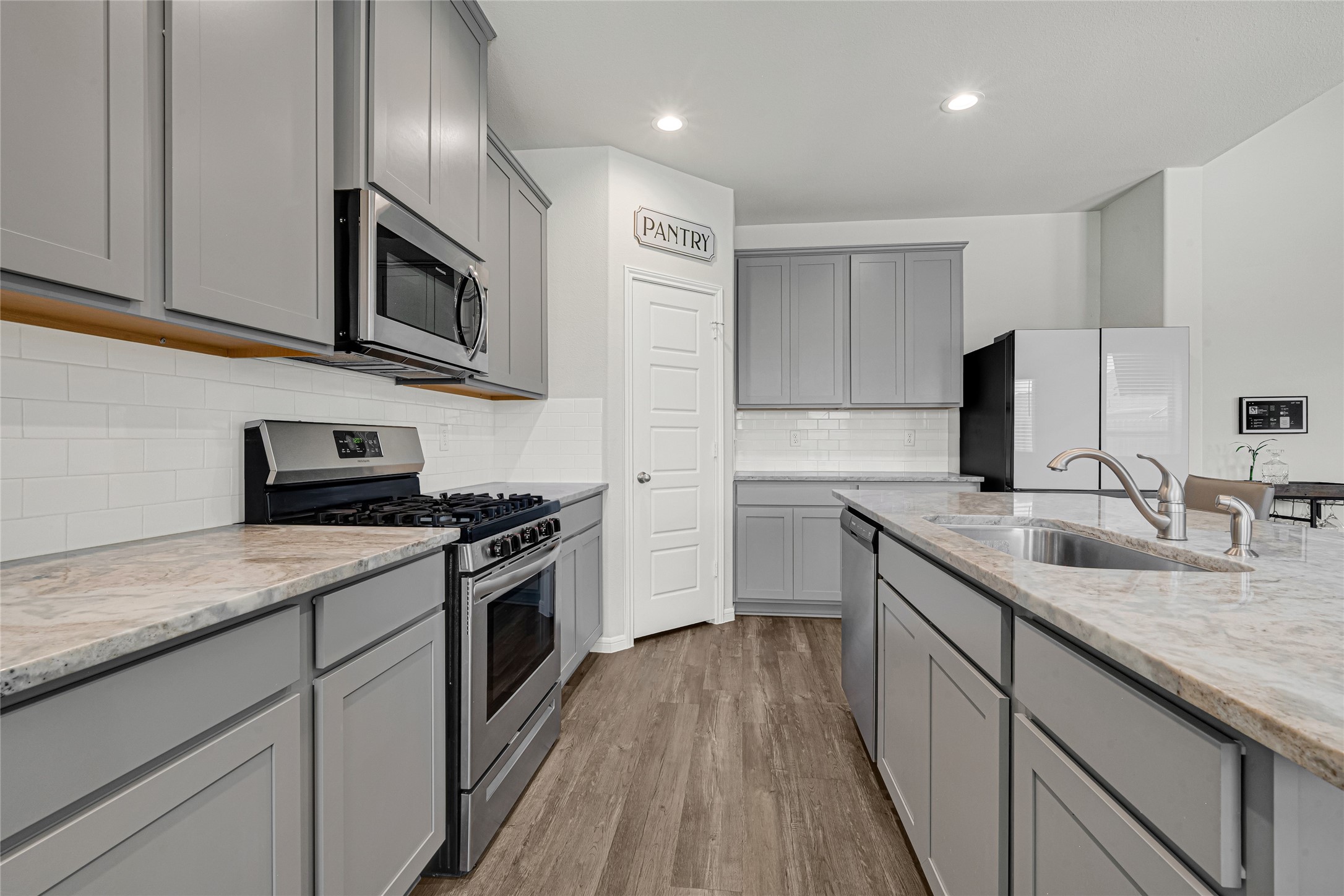 4206 Fenwick Road Texas City, TX 77591 - Photo 6 of 26 The Kitchen provides ample storage and counter space, as well as a 5-burner gas stove.