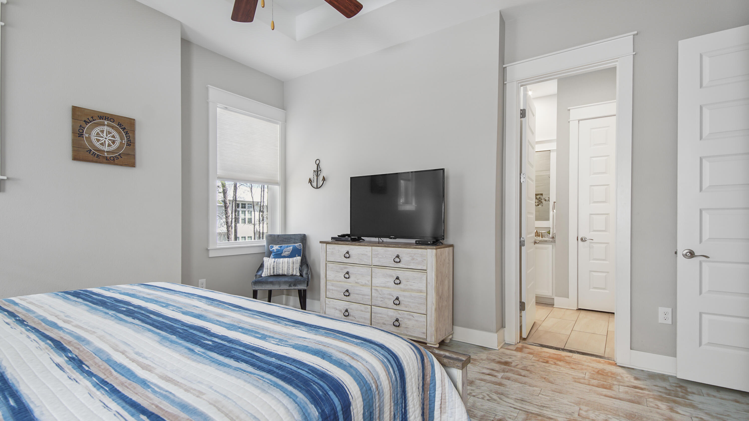 54 West W Pine, Unit A Inlet Beach, FL 32461 - Photo 16 of 27 a bedroom with a bed and a flat screen tv