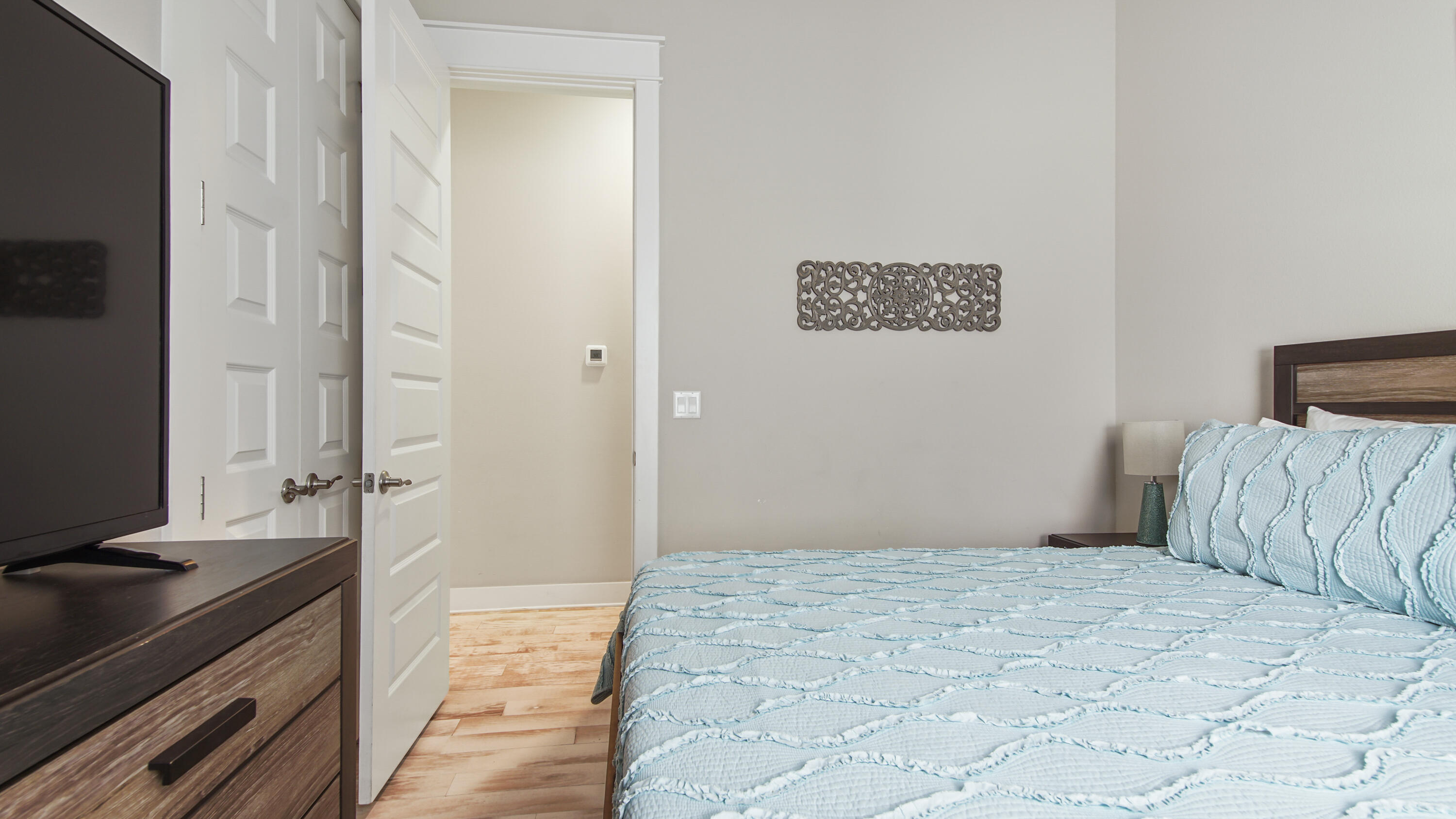 54 West W Pine, Unit A Inlet Beach, FL 32461 - Photo 21 of 27 a bedroom with a bed and a television