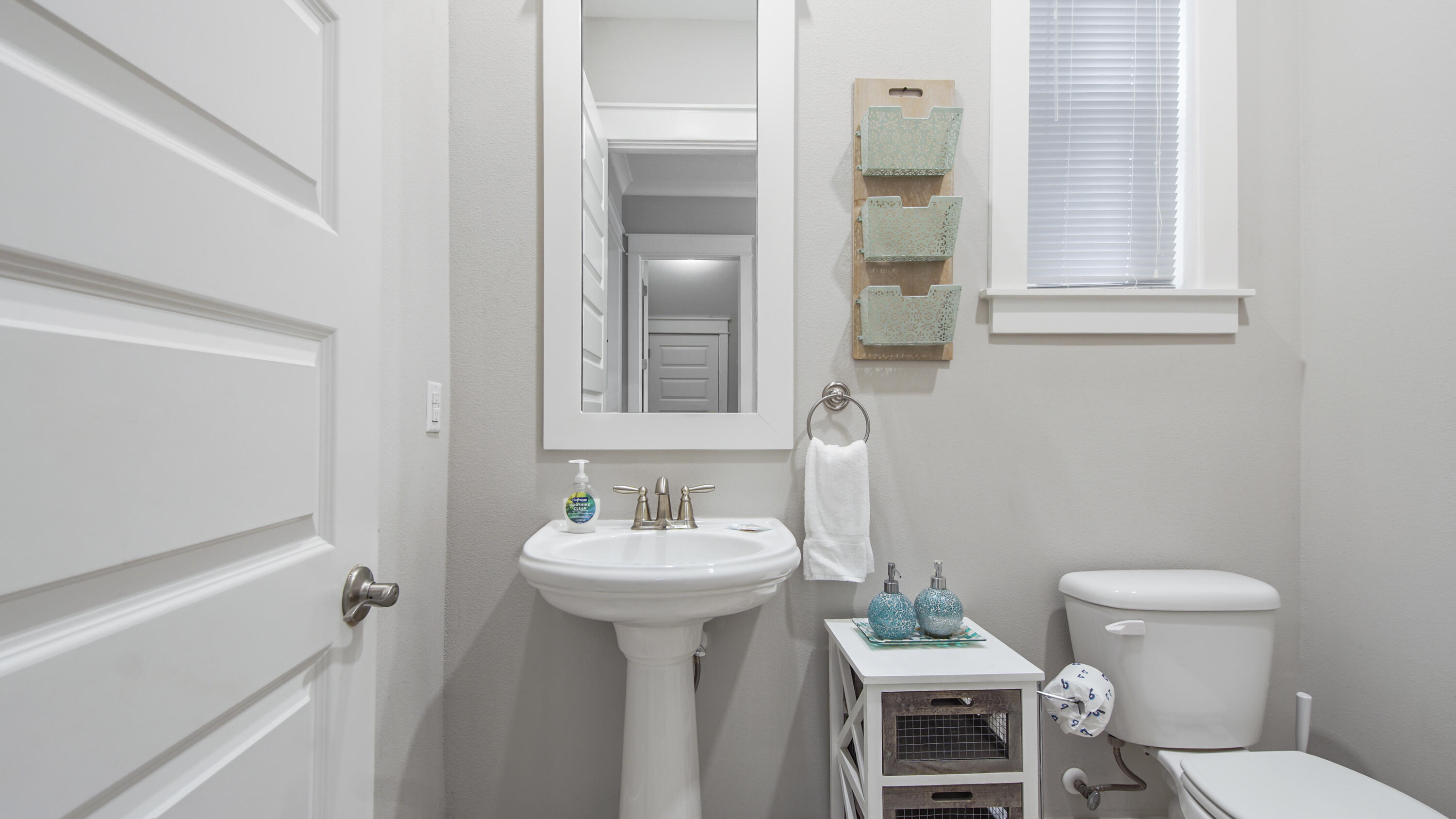 54 West W Pine, Unit A Inlet Beach, FL 32461 - Photo 26 of 27 a bathroom with a sink toilet and mirror