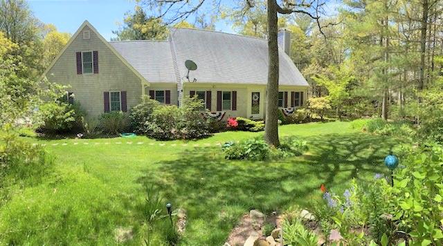 85 Beach Road Orleans, MA 02653 - Photo 1 of 26 a front view of house with yard and green space