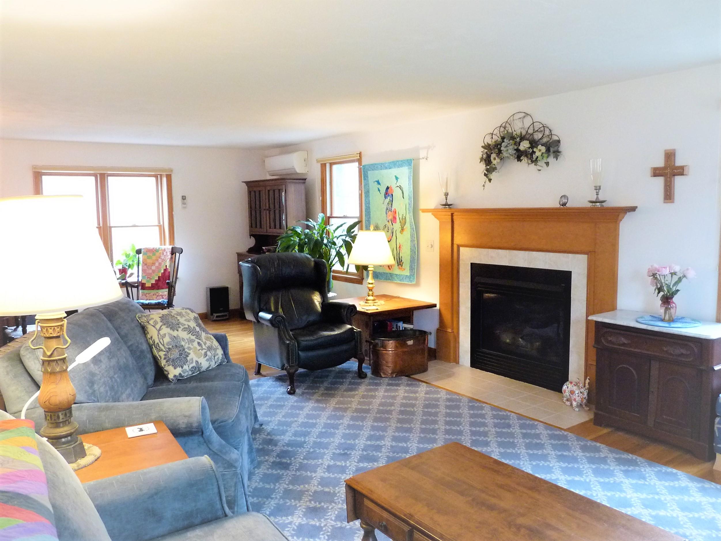 85 Beach Road Orleans, MA 02653 - Photo 4 of 26 a living room with furniture and a fireplace