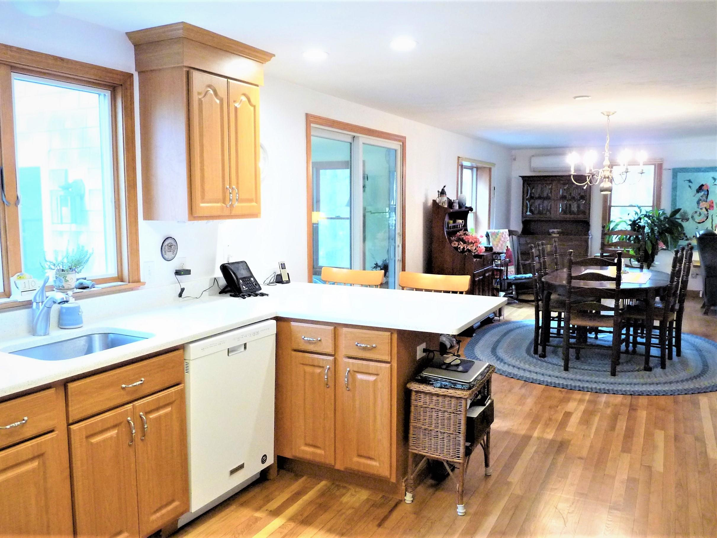 85 Beach Road Orleans, MA 02653 - Photo 7 of 26 a large kitchen with kitchen island a large counter space a sink and appliances