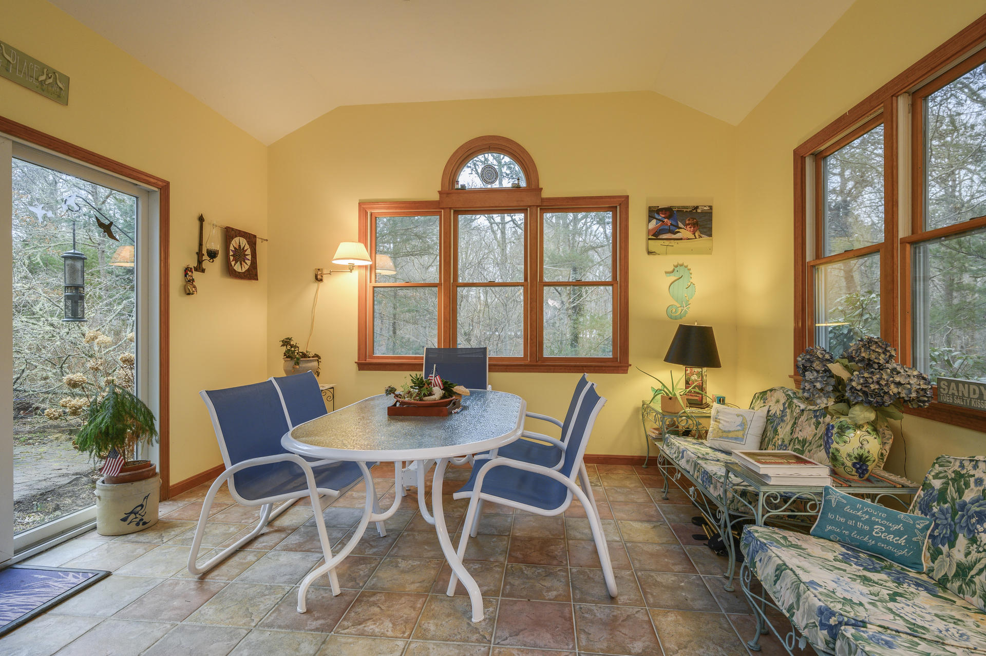 85 Beach Road Orleans, MA 02653 - Photo 8 of 26 a view of a dining room with furniture window and outside view