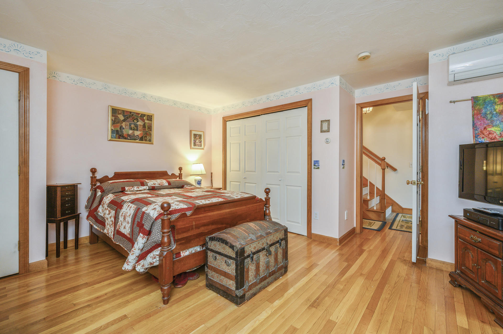 85 Beach Road Orleans, MA 02653 - Photo 9 of 26 a bedroom with a bed and a flat screen tv