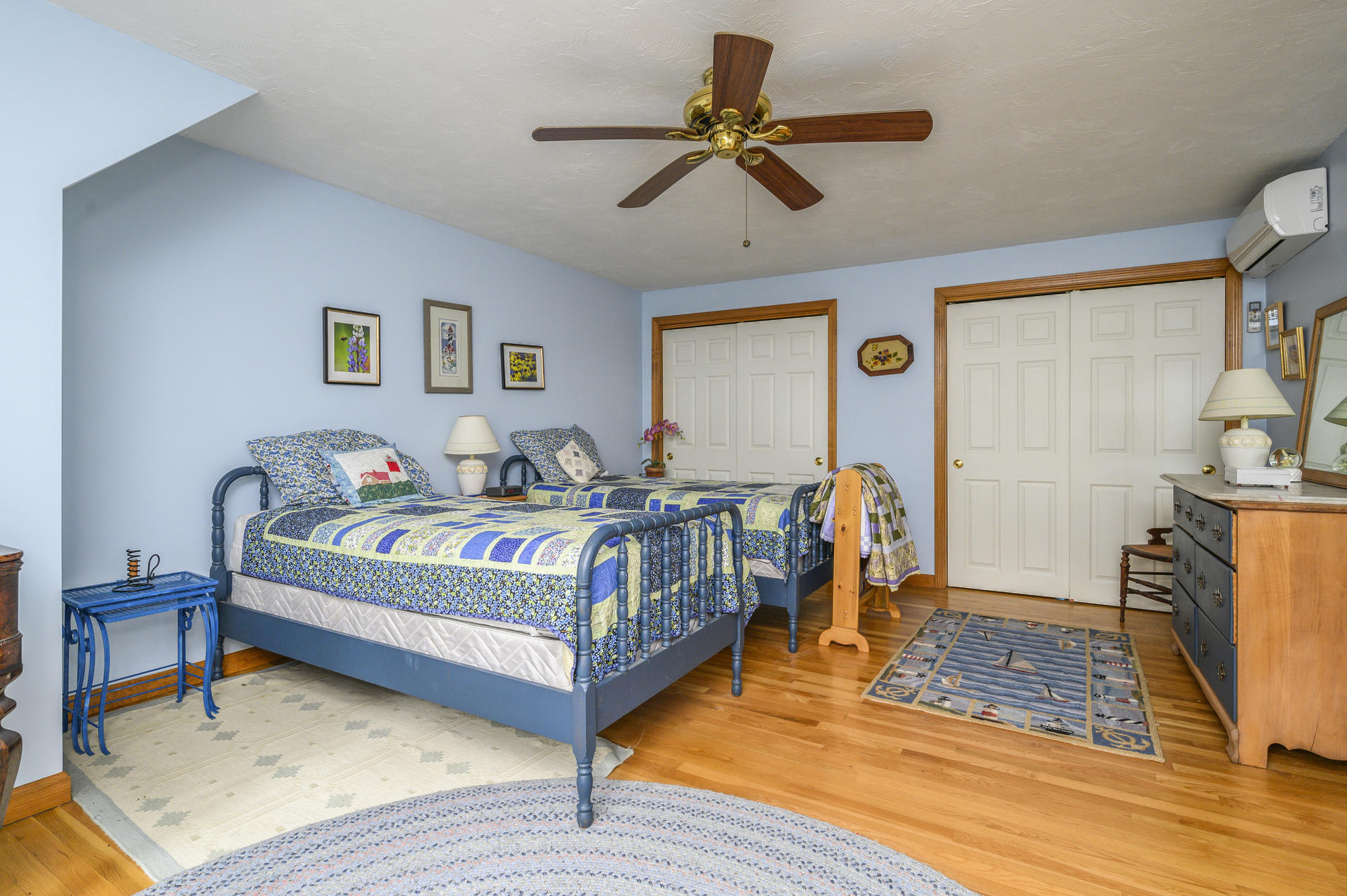 85 Beach Road Orleans, MA 02653 - Photo 10 of 26 a bedroom with a bed and a chandelier