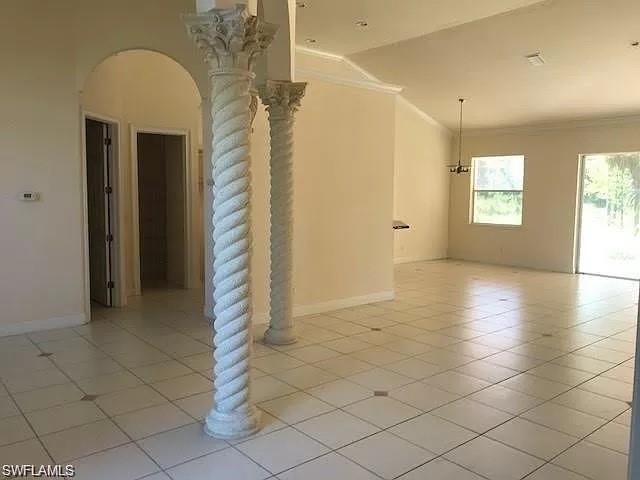 2060 16th Avenue Southwest Naples, FL 34117 - Photo 3 of 13 a view of a room has a large window and chandelier fan