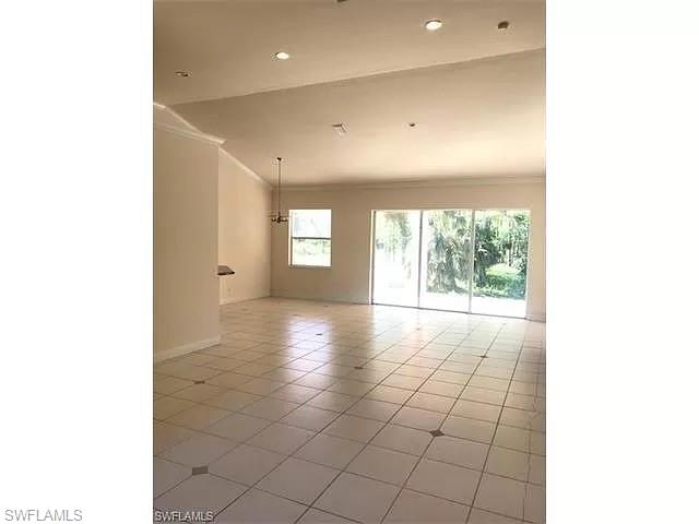 2060 16th Avenue Southwest Naples, FL 34117 - Photo 5 of 13 a view of a livingroom with a staircase