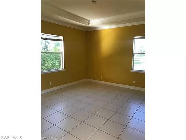 2060 16th Avenue Southwest Naples, FL 34117 - Photo 6 of 13 a view of a room with a window