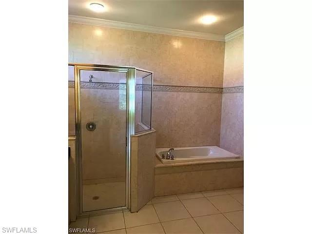 2060 16th Avenue Southwest Naples, FL 34117 - Photo 10 of 13 a bathroom with a shower and a sink