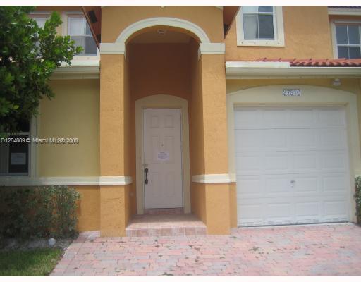 a front view of a house with parking area