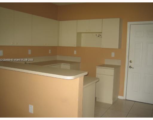 27510 Southwest 138th Path Homestead, FL 33032 - Photo 3 of 11 a bathroom with a sink and a toilet