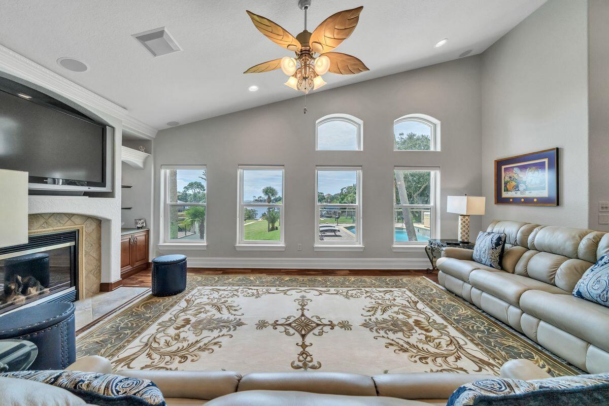 245 Country Club Road Shalimar, FL 32579 - Photo 13 of 46 a living room with furniture and a flat screen tv