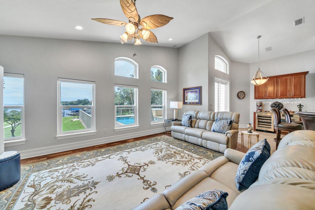 245 Country Club Road Shalimar, FL 32579 - Photo 14 of 46 a living room with furniture and a flat screen tv