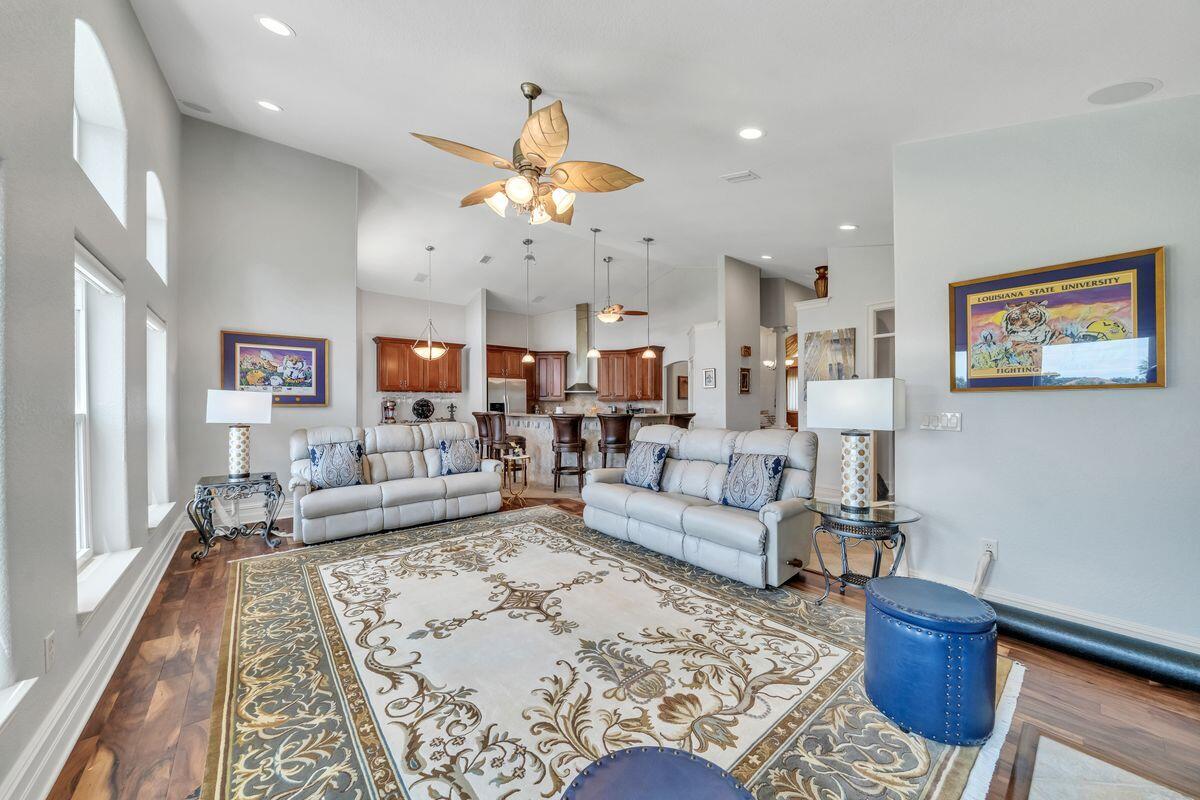 245 Country Club Road Shalimar, FL 32579 - Photo 16 of 46 a living room with furniture kitchen view and a rug