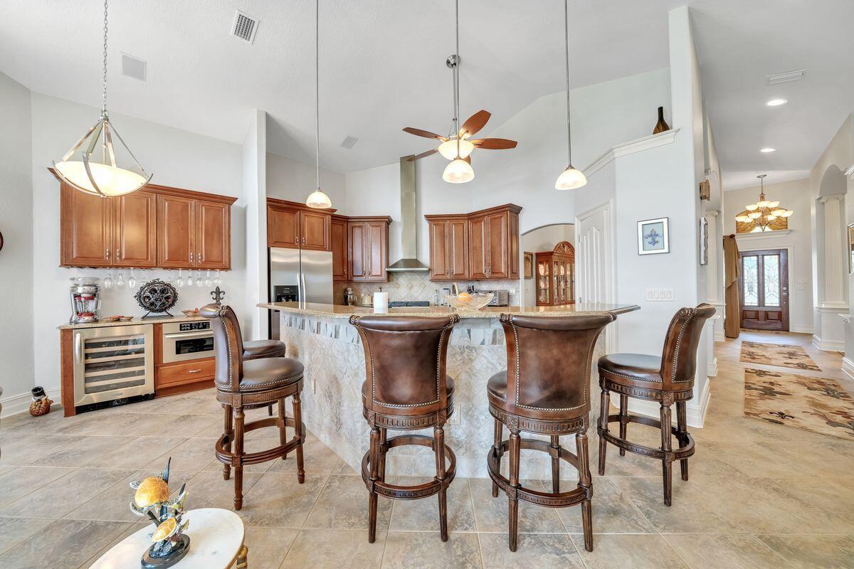 245 Country Club Road Shalimar, FL 32579 - Photo 23 of 46 a view of kitchen and dining area with furniture