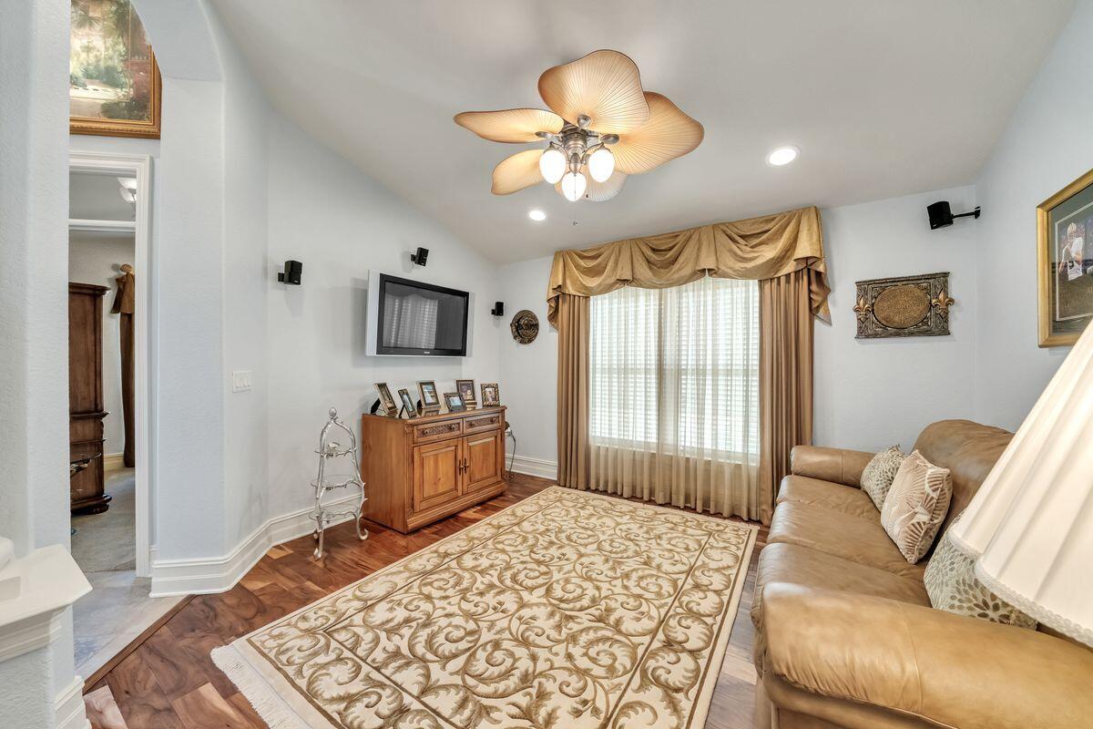 245 Country Club Road Shalimar, FL 32579 - Photo 25 of 46 a bedroom with a large bed and a couch