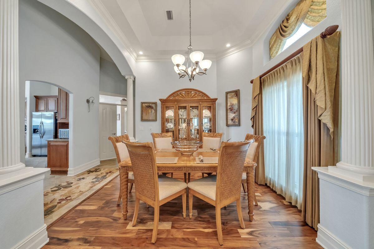 245 Country Club Road Shalimar, FL 32579 - Photo 26 of 46 a view of a dining room with furniture window and wooden floor