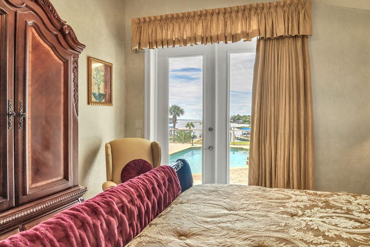 245 Country Club Road Shalimar, FL 32579 - Photo 28 of 46 a bedroom with a bed and a window