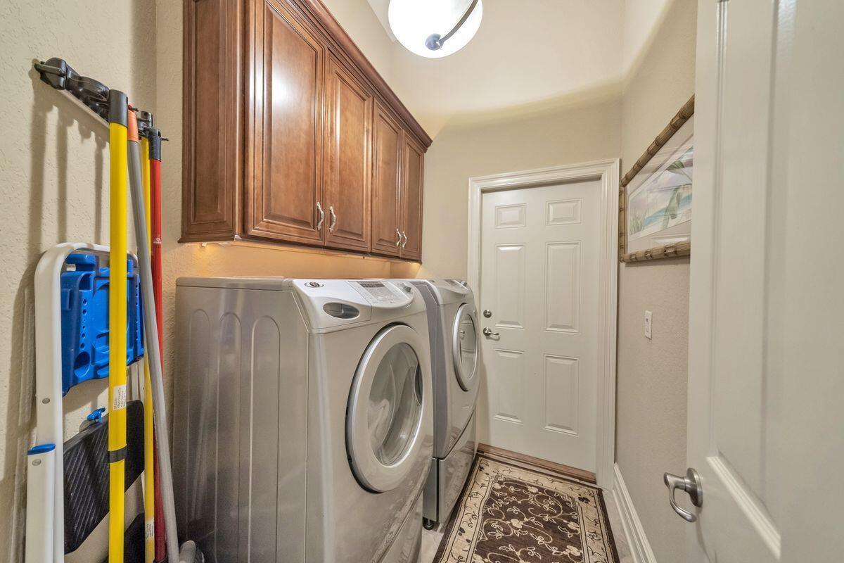 245 Country Club Road Shalimar, FL 32579 - Photo 33 of 46 a view of walk in closet with clothes and shoes