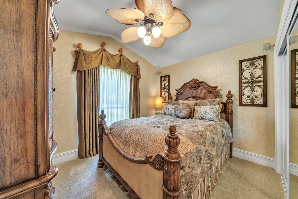 245 Country Club Road Shalimar, FL 32579 - Photo 35 of 46 a bed sitting in a bedroom next to a window