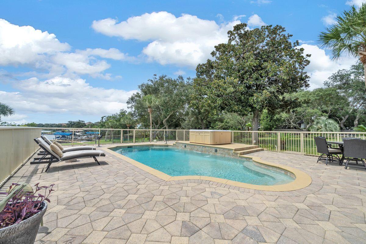 245 Country Club Road Shalimar, FL 32579 - Photo 41 of 46 a view of a swimming pool with a lounge chair