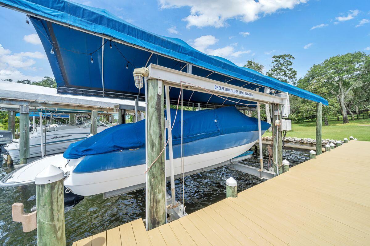 245 Country Club Road Shalimar, FL 32579 - Photo 10 of 46 a view of house with a swimming pool