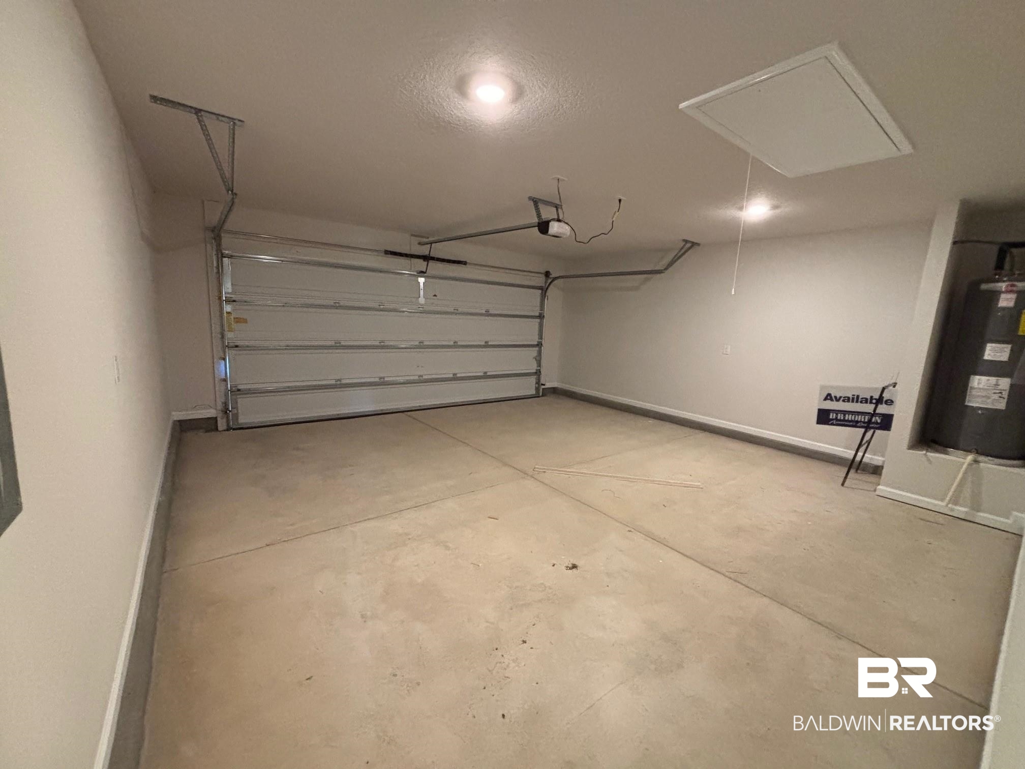 22044 Aleutian Avenue Foley, AL 36535 - Photo 20 of 28 Garage with water heater and a garage door opener
