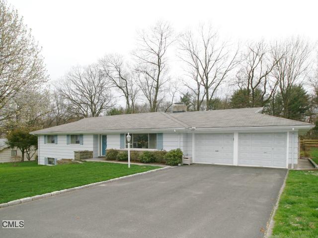 105 Oak Ridge Road Stratford, CT 06614 - Photo 1 of 1 a view of a white house with a yard and large tree