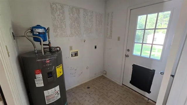 a kitchen with stainless steel appliances a refrigerator and wooden floor