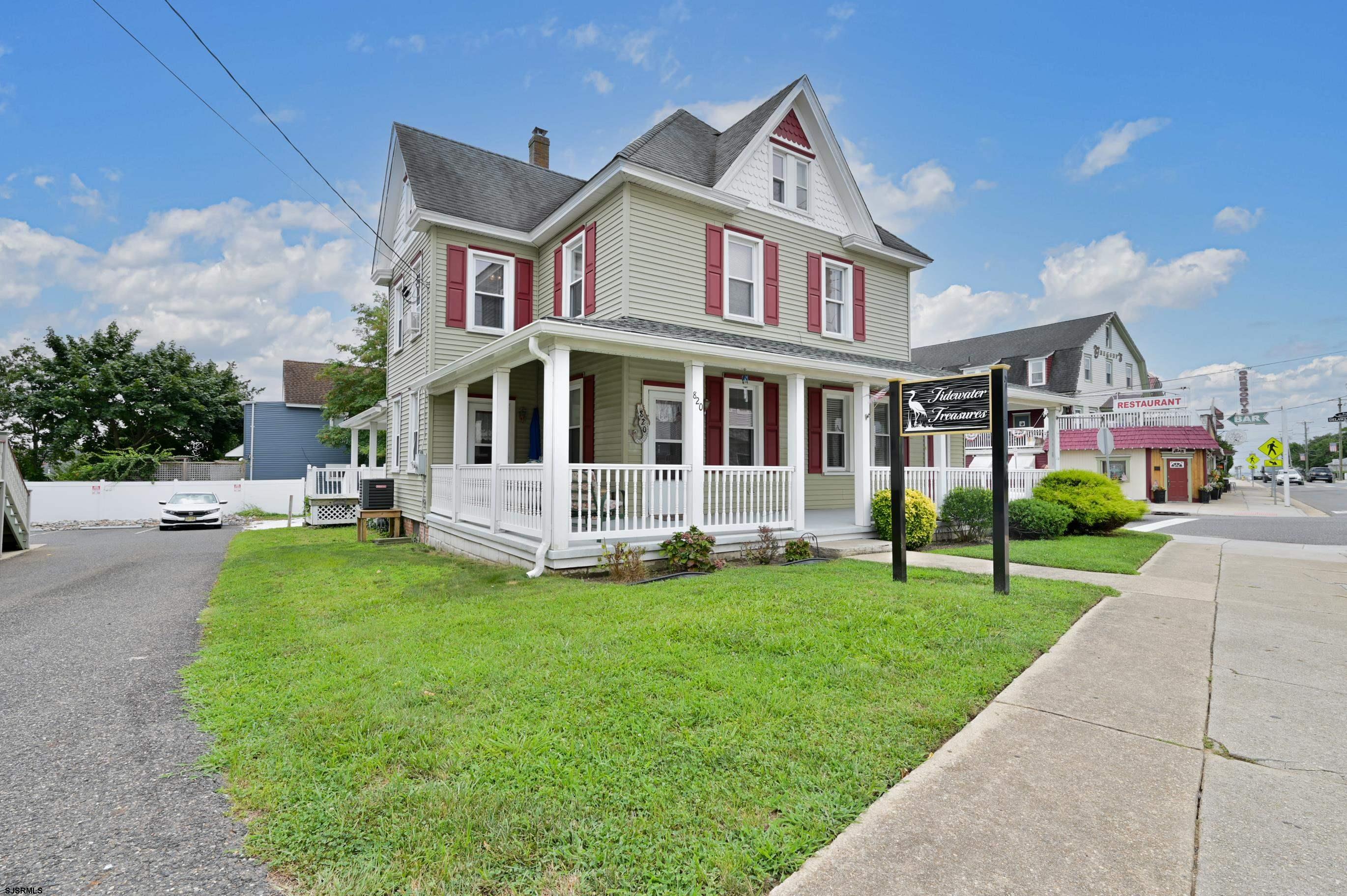 a view of a house with a yard and plants