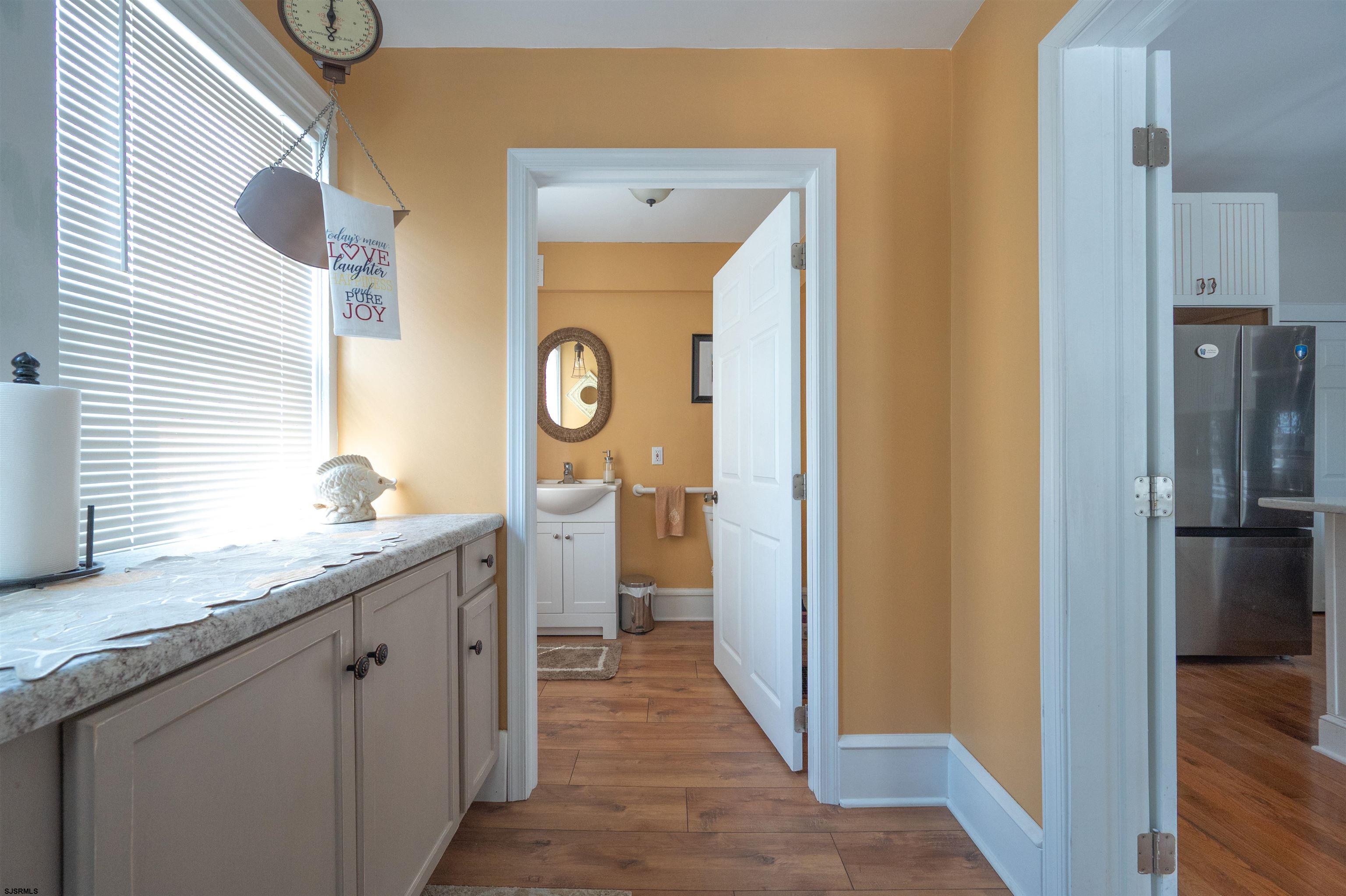 820-822 Shore Somers Point, NJ 08244 - Photo 11 of 27 a bathroom with a granite countertop sink and a mirror