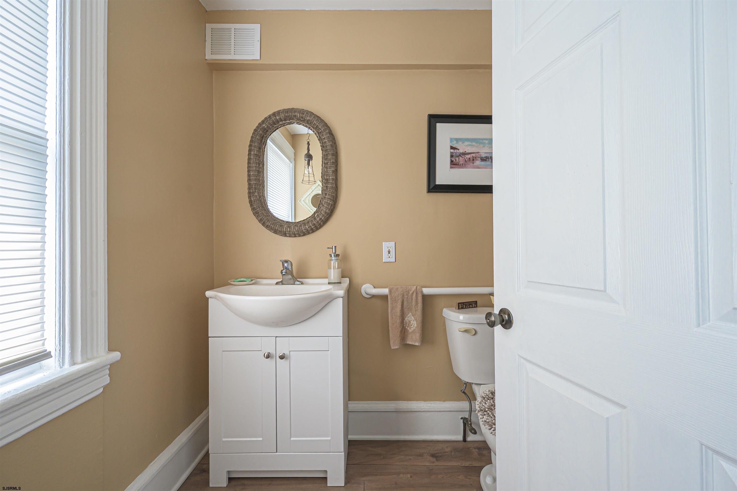 820-822 Shore Somers Point, NJ 08244 - Photo 12 of 27 a bathroom with a sink and a mirror