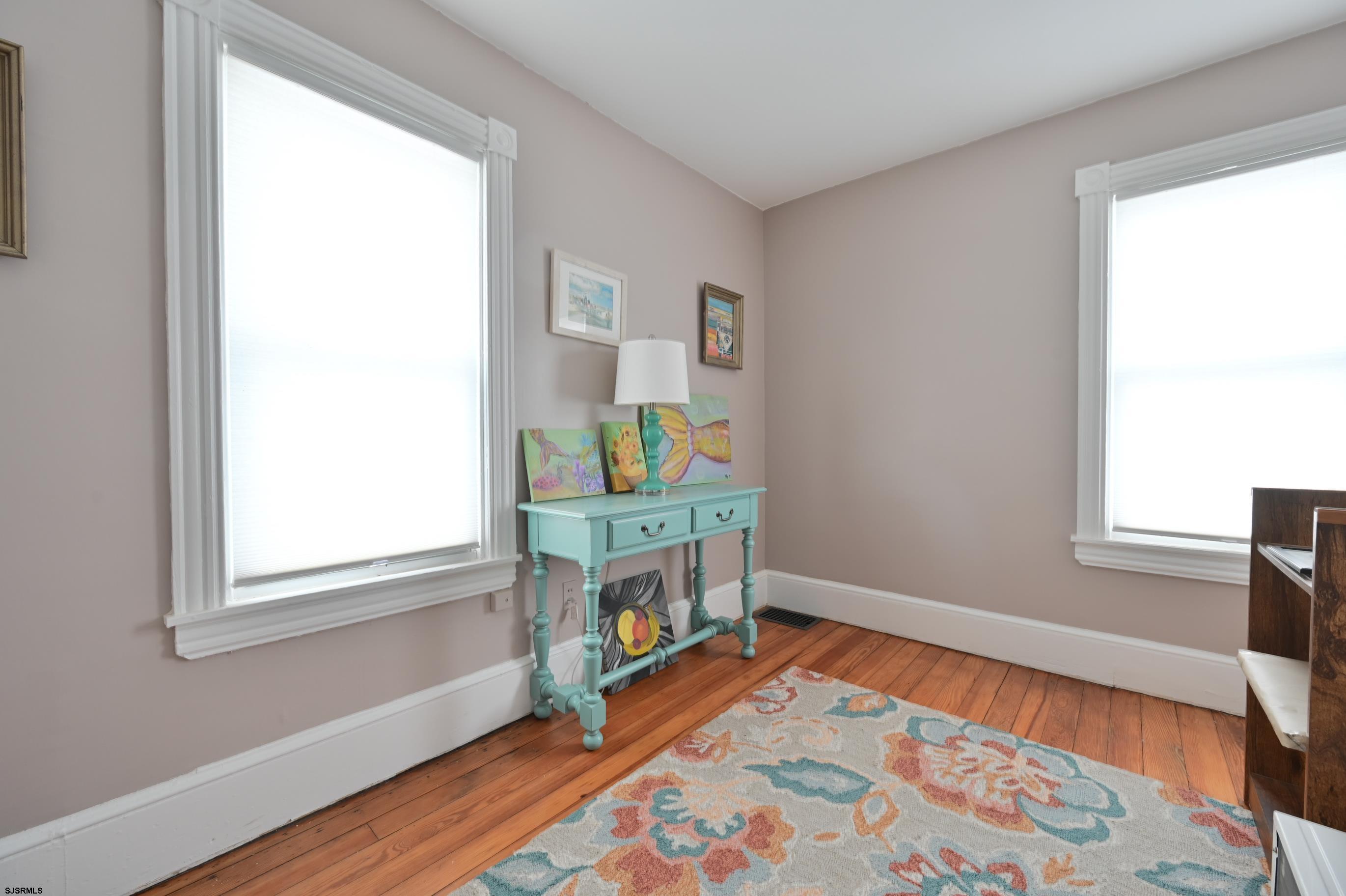 820-822 Shore Somers Point, NJ 08244 - Photo 19 of 27 a bedroom with a bed and a window