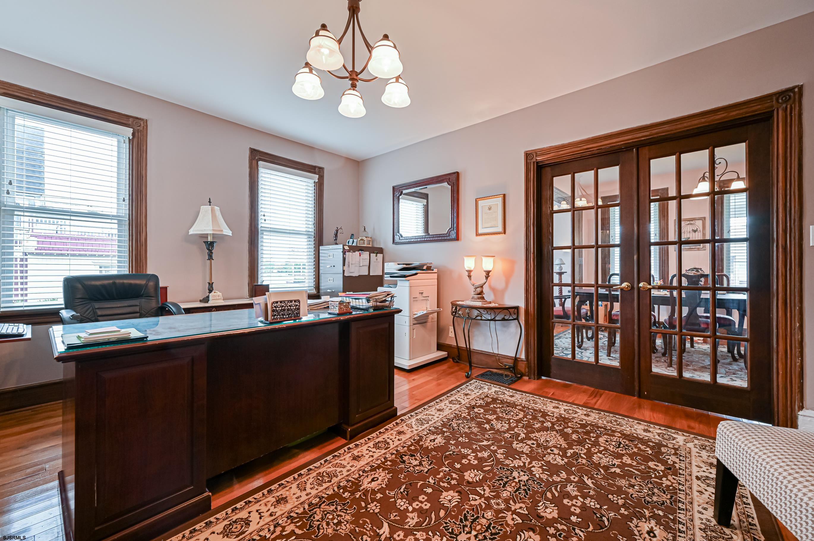 820-822 Shore Somers Point, NJ 08244 - Photo 2 of 27 a open kitchen with stainless steel appliances granite countertop a stove top oven a sink dishwasher and a dining table with wooden floor