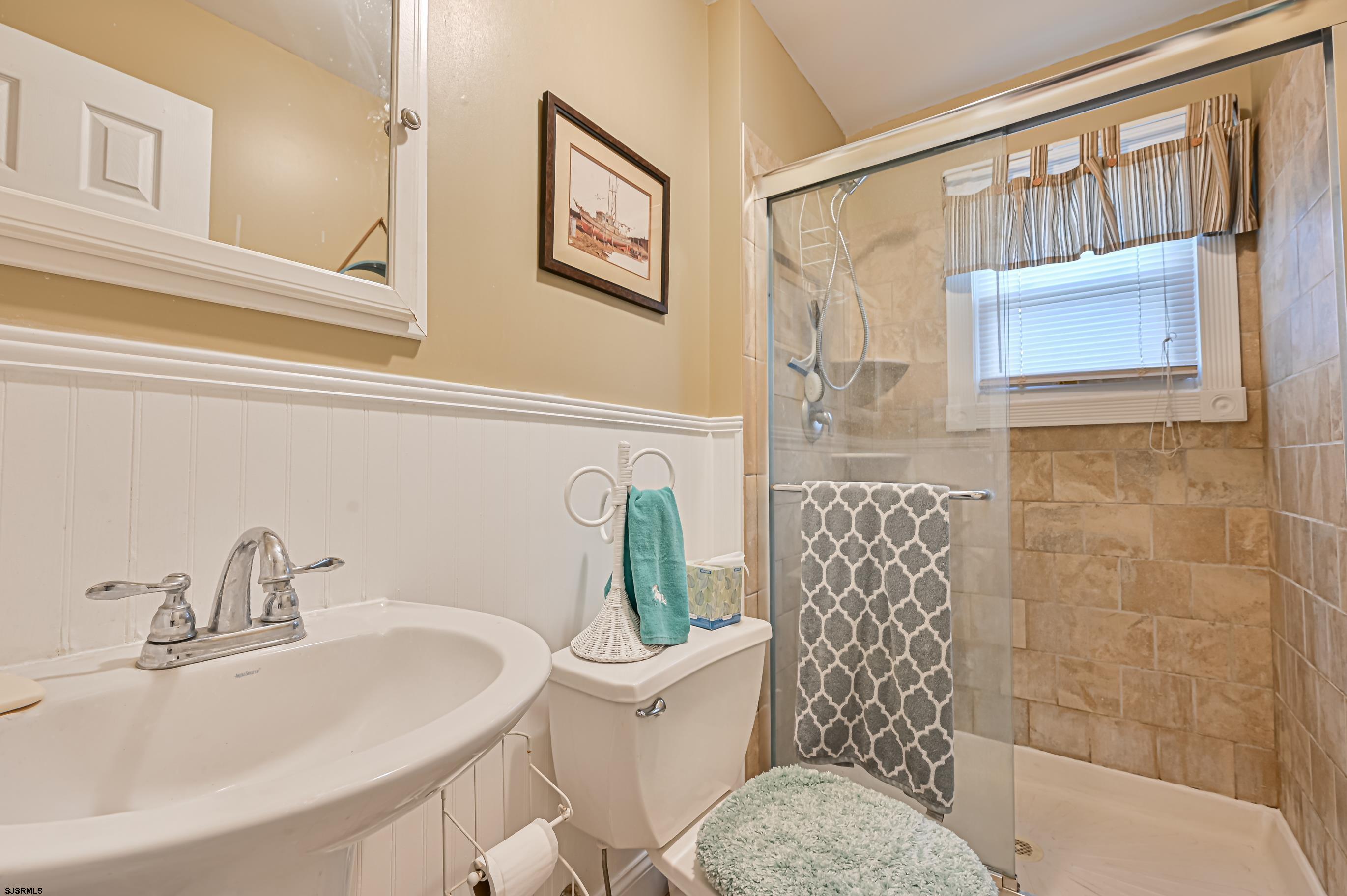 820-822 Shore Somers Point, NJ 08244 - Photo 21 of 27 a bathroom with a toilet sink and shower