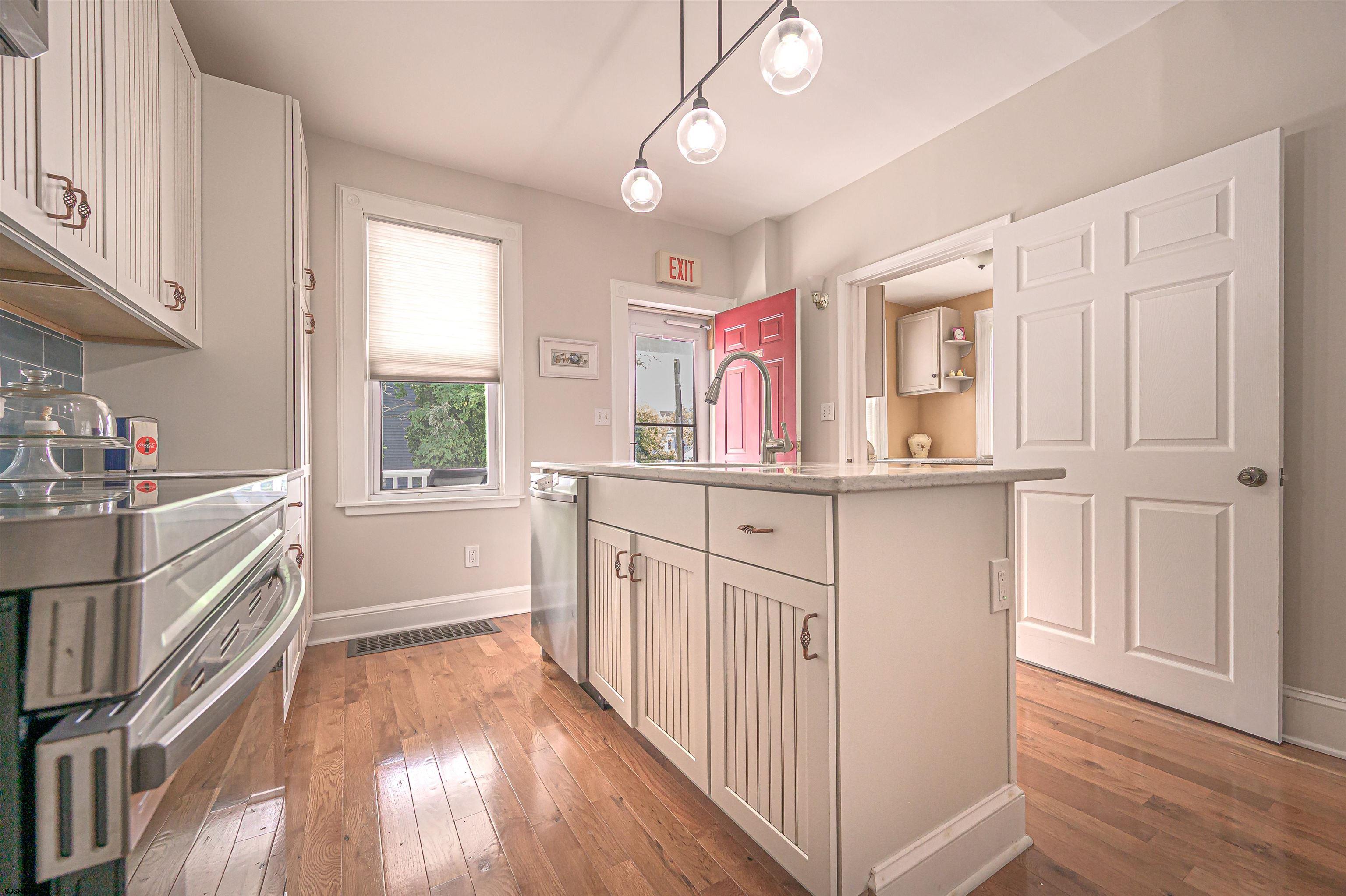 820-822 Shore Somers Point, NJ 08244 - Photo 7 of 27 a kitchen with cabinets a sink and appliances
