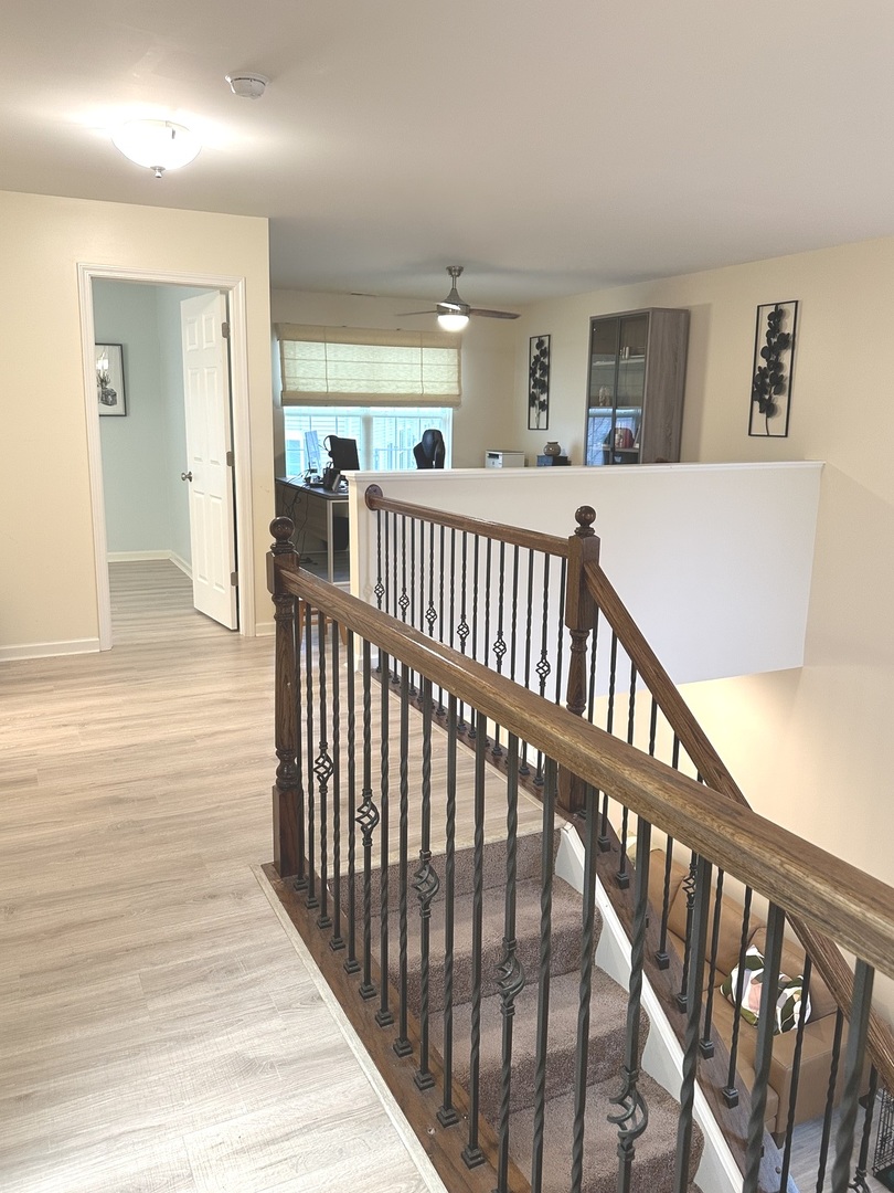 5102 Monroe Street Matteson, IL 60443 - Photo 34 of 54 a view of a hallway with bedroom and wooden floor