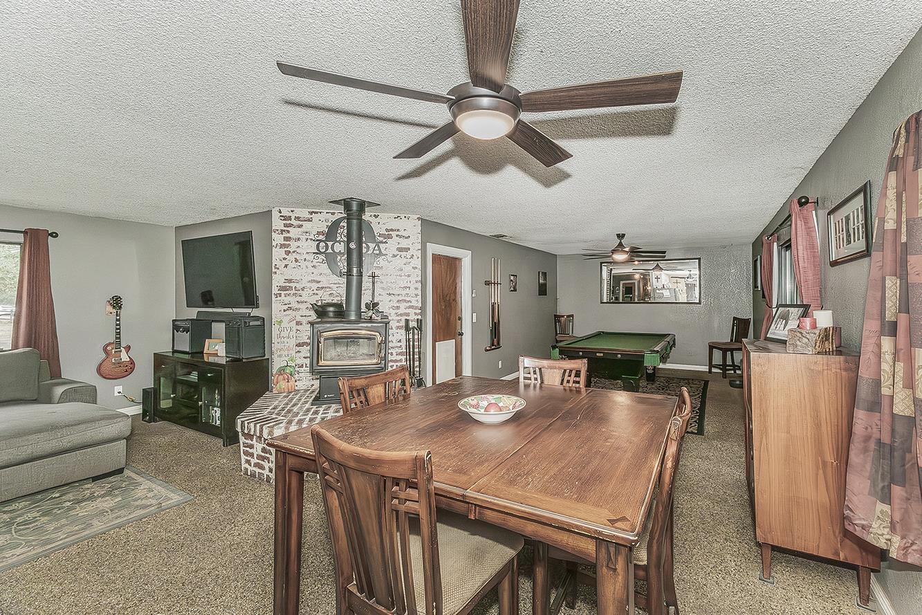29545 Oak Meadow Road Tollhouse, CA 93667 - Photo 18 of 69 a view of a dining room with furniture and a chandelier